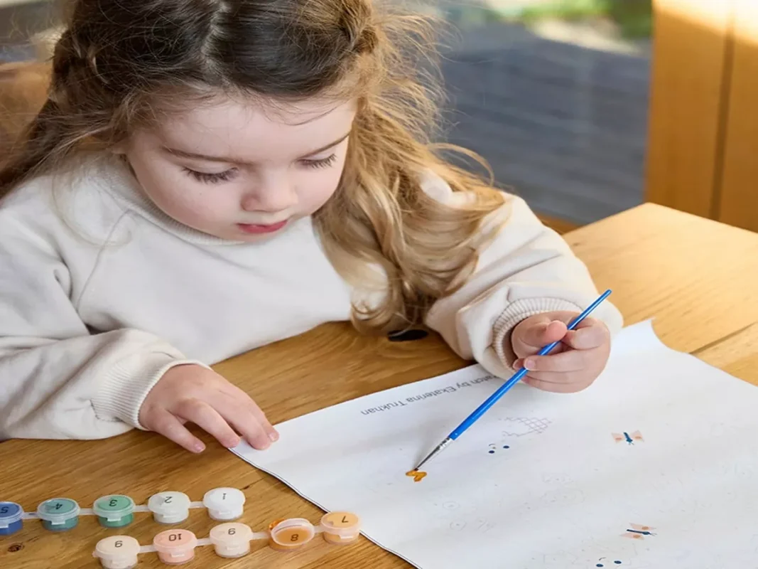 kid painting by number a flower