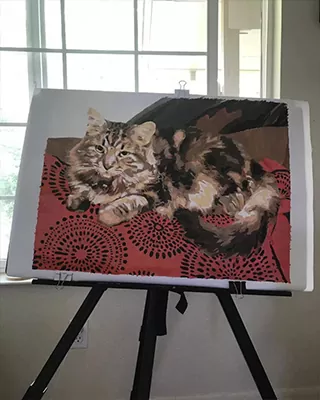 A cozy afternoon nap preserved in a custom paint by numbers portrait of a fluffy tabby cat