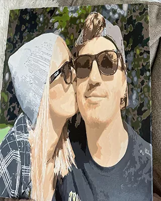 A sweet kiss captured forever in a custom paint by numbers couple portrait