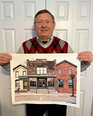 Custom paint by numbers artwork featuring a historic brick building proudly displayed by its owner