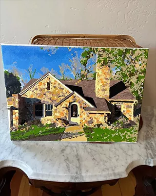 Custom paint by numbers of a sunlit stone cottage with lush trees and a bright blue sky