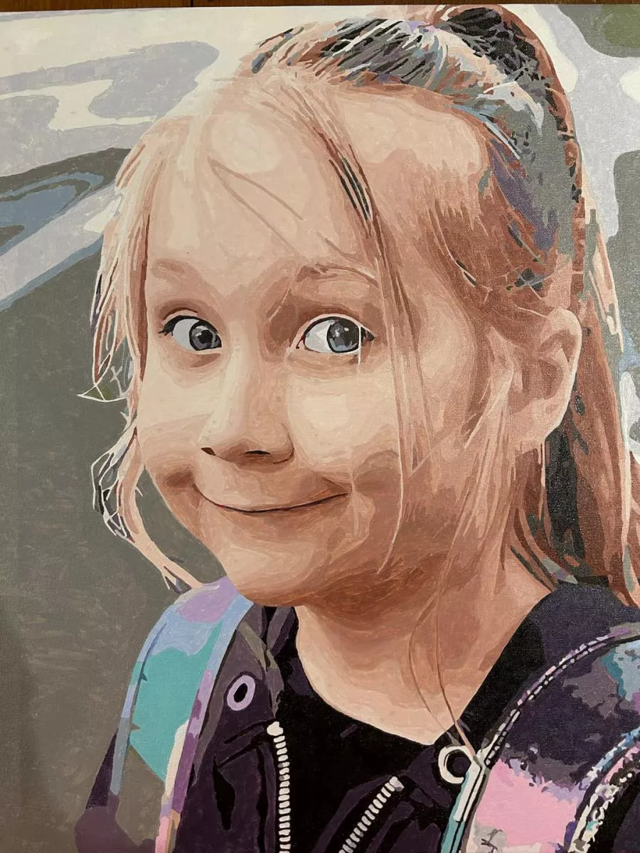 Custom paint by numbers portrait of a smiling young girl with a playful expression