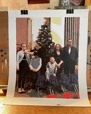 Family holiday portrait turned into a custom paint by numbers canvas displayed before framing