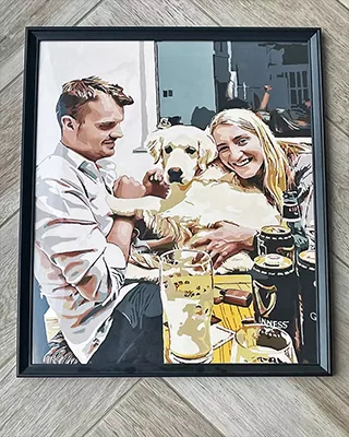 Framed paint by numbers portrait capturing a happy couple with their golden retriever