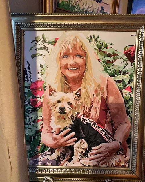 Personalized paint by numbers artwork of a woman and her cherished pet