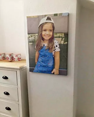 Personalized paint by numbers portrait of a smiling young girl displayed as wall art
