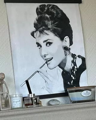 Black and white portrait of an elegant woman with a classic updo