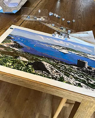 Coastal landscape with deep blue water recreated as a custom paint by numbers artwork