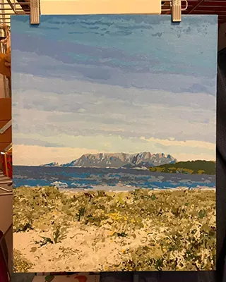 Coastal landscape with distant mountains recreated as a personalized paint by numbers artwork