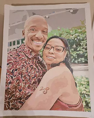 Couple embracing and smiling in a personalized paint by numbers portrait