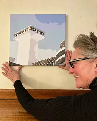 Custom paint by numbers cityscape displayed by its proud owner on a living room wall