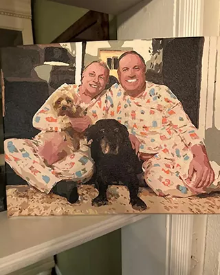 Custom paint by numbers family portrait with two adults and their beloved dogs