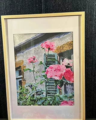Custom paint by numbers landscape of pink roses blooming outside a rustic cottage window.