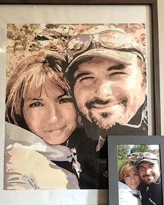 Custom paint by numbers portrait displayed beside the original couple's photo
