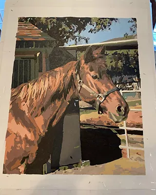Custom paint by numbers portrait of a chestnut horse standing beside a stable