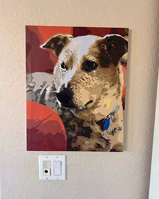 Custom paint by numbers portrait of a dog displayed on the wall