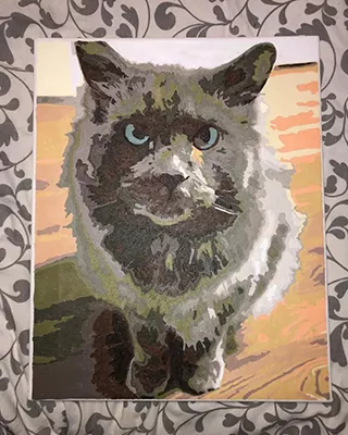 Custom paint by numbers portrait of a fluffy gray cat with striking amber eyes