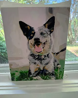 Custom paint by numbers portrait of a happy dog with large pointed ears sitting outdoors
