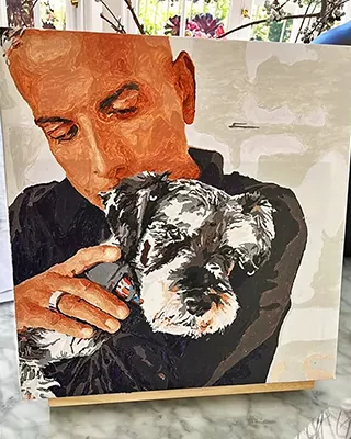 Custom paint by numbers portrait of a man cuddling his beloved Schnauzer
