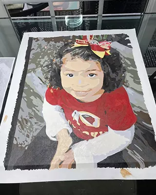 Custom paint by numbers portrait of a smiling little girl wearing a festive red outfit and bow