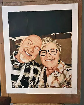 Custom paint by numbers portrait of a smiling older couple recreated from a favorite photo.
