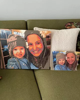 Custom paint by numbers portrait of a smiling woman and young child displayed beside the original photo