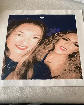 Custom paint by numbers portrait of two smiling friends captured in a selfie