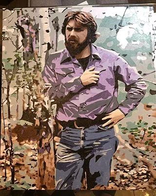 Custom portrait of a bearded man standing in a wooded landscape