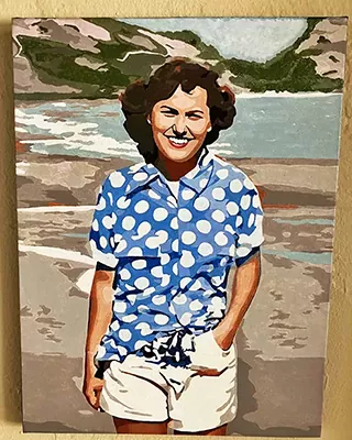Custom portrait of a smiling woman standing on a beach