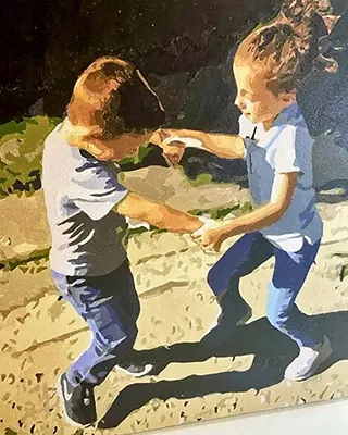 Custom portrait of two children holding hands and playing outside