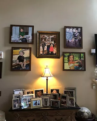 Family photo gallery displayed as framed custom paint by numbers portraits