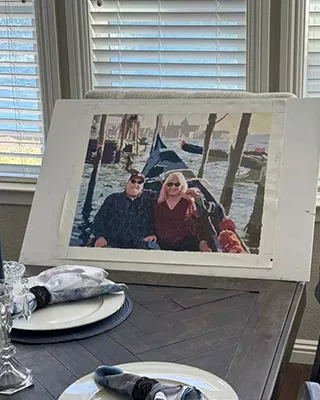 Finished custom paint by numbers portrait of a couple enjoying a boat trip