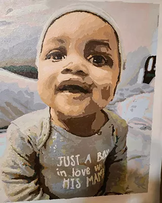Finished custom paint by numbers portrait of a smiling baby