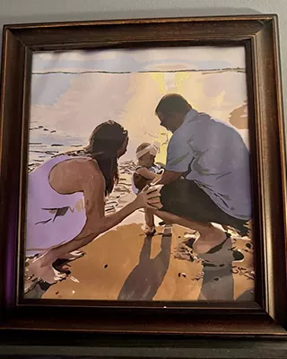 Framed custom paint by numbers of a family enjoying a sunset at the beach