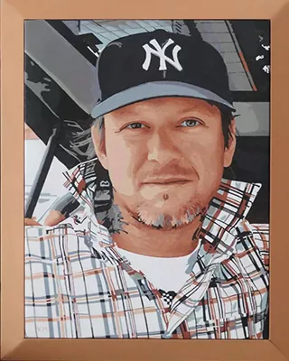 Framed custom paint by numbers portrait of a man wearing a baseball cap and plaid shirt