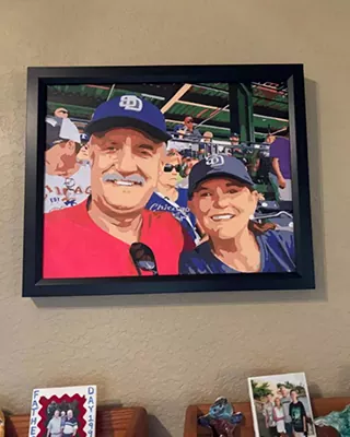Framed custom paint by numbers portrait of a smiling couple at a baseball game
