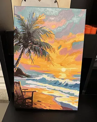 Peaceful paint by numbers of a tropical beach at sunset with swaying palms