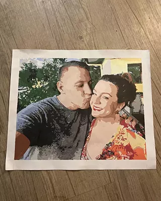 Personalized paint by numbers portrait of a couple sharing a sweet moment