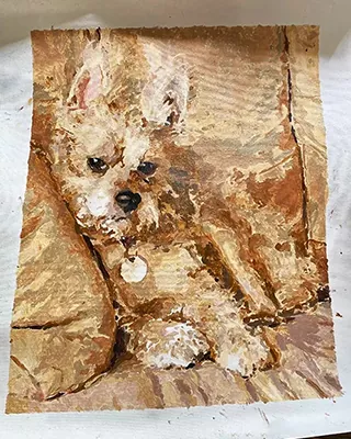 Small fluffy dog resting on a sofa in a custom paint by numbers portrait