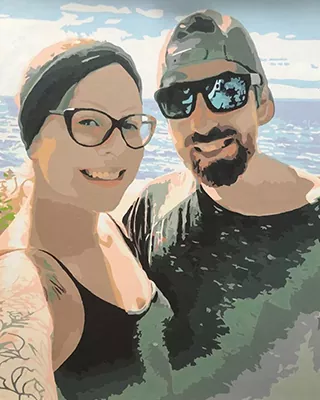 Smiling couple posing together by the water in a custom paint by numbers portrait
