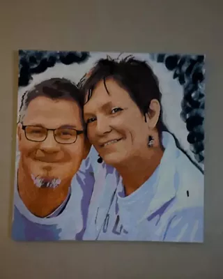Smiling couple posing together in a custom paint by numbers portrait
