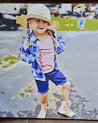 Smiling little girl in a custom paint by numbers portrait