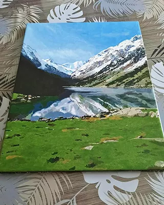 Snowy mountain peaks reflected in a clear alpine lake in a custom paint by numbers landscape
