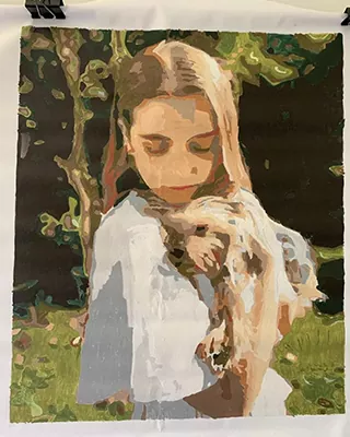 Young girl gently holding her dog in a personalized paint by numbers portrait