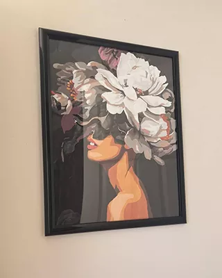 paint by numbers portrait of a woman in profile crowned with oversized white and muted blossoms